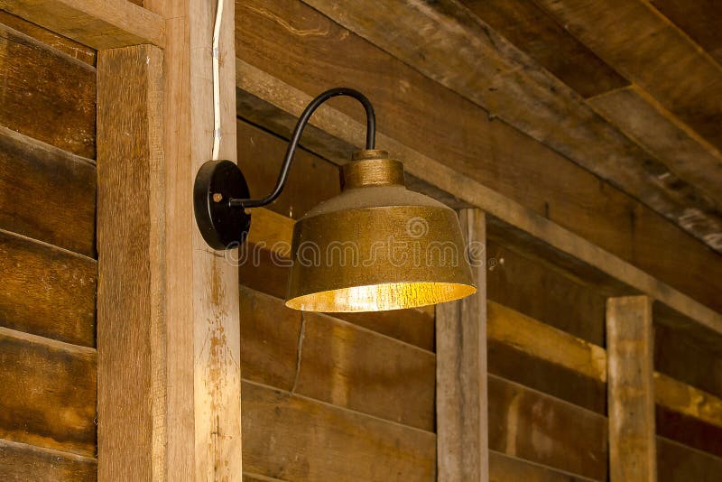 Lamp made of brass attached to the wall stock photo Lamp made of brass attached to the wall stock photo
