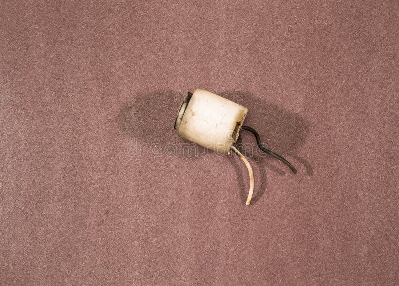 An old lamp socket with protruding wires stock images