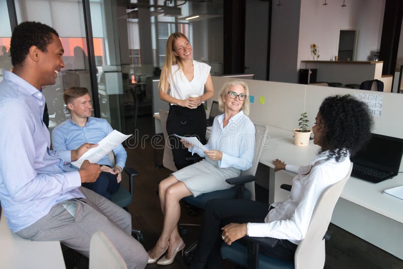 Old leader talking to team presenting work plan at meeting stock photo Old leader talking to team presenting work plan at meeting stock photo