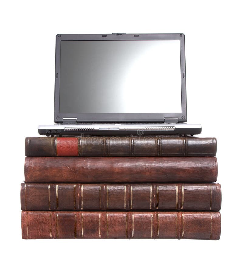 Old leather bound books with a laptop