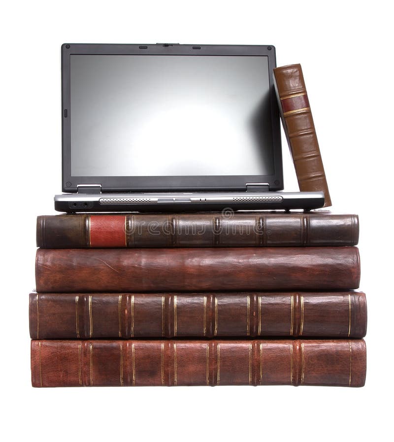 Old leather bound books with a laptop