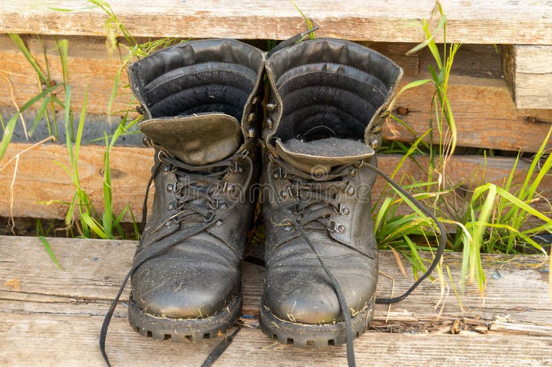 Old Leather Hiking Boots on the Porch of a Village House. Summer is a ...