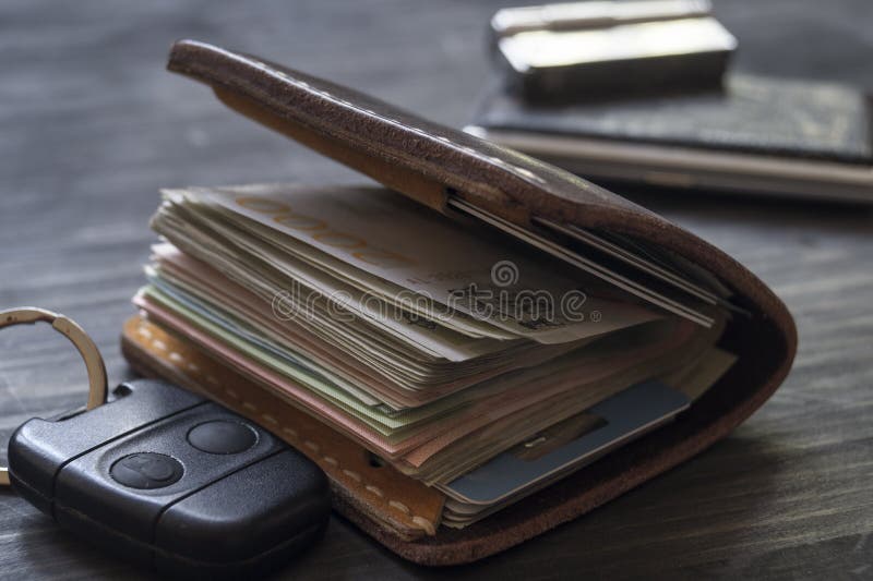 Old Leather Wallet Full of Money on Wooden Background Stock Image ...