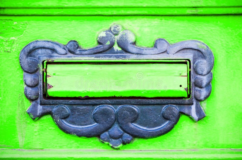 Old letterbox or mailbox in the gate door traditional way of delivering letters or mail to the house address close up royalty free stock image Old letterbox or mailbox in the gate door traditional way of delivering letters or mail to the house address close up royalty free stock image