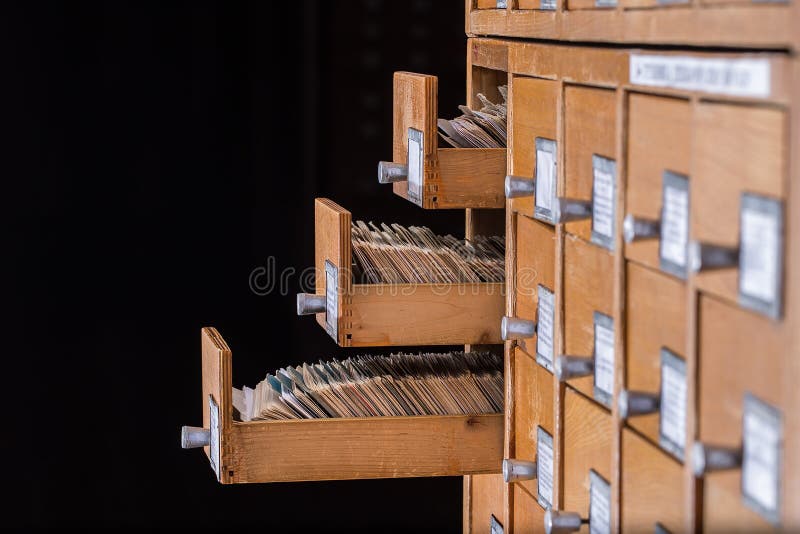 Old library reference catalogue with opened card drawer. Database and knowledge catalog concept.