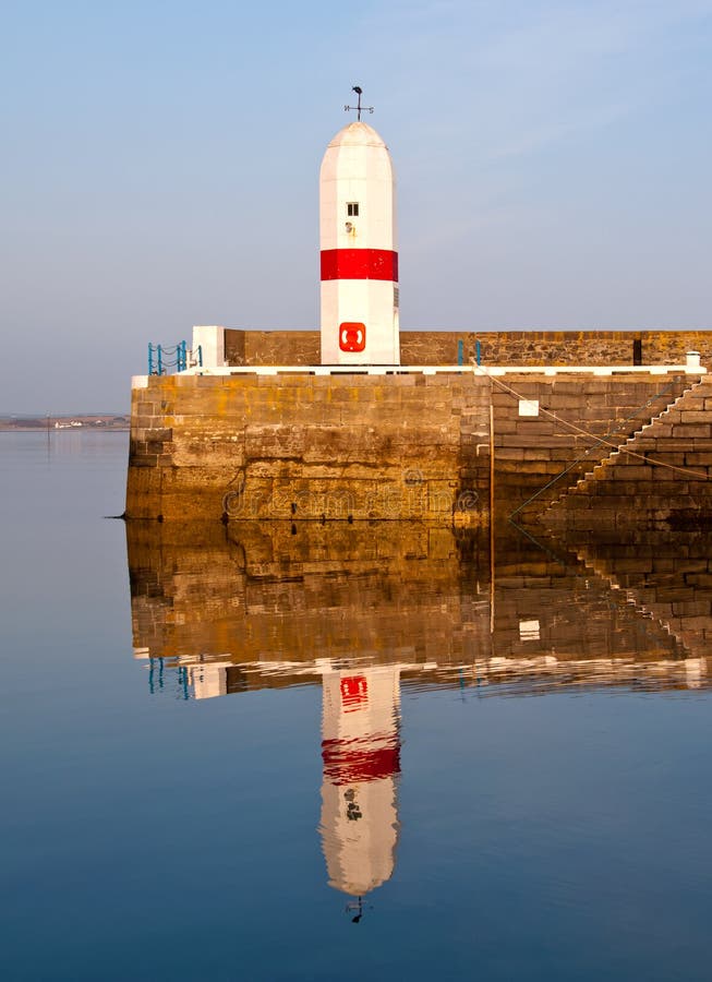 Old Lighthouse with Sea Water Reflection