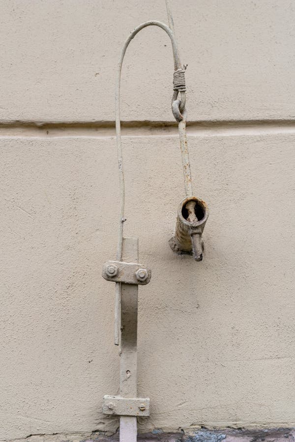 Old lightning protection in a detached house. Lightning protection cables stock photography