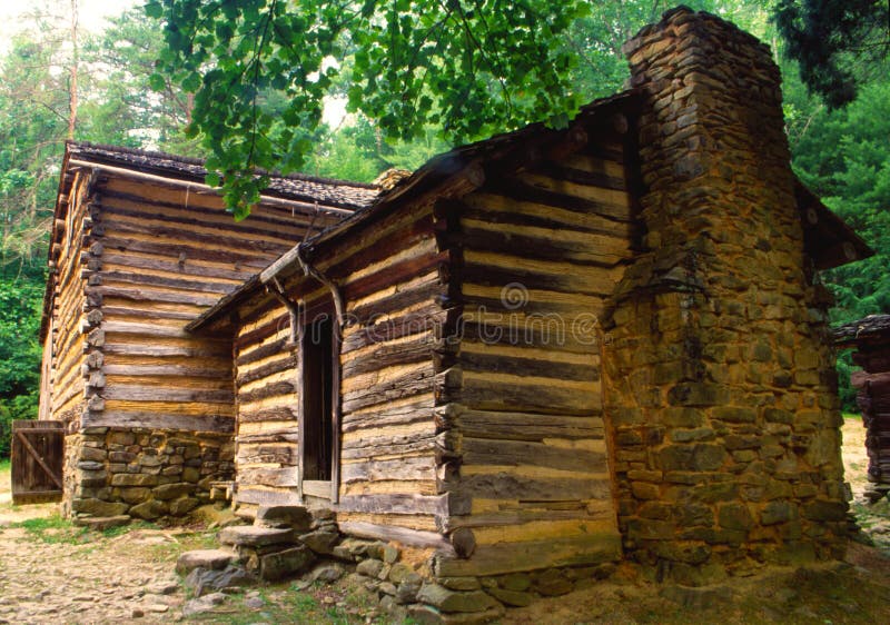 Old Log Pioneer Home with a Rock Fireplace. Stock Photo Image of cove