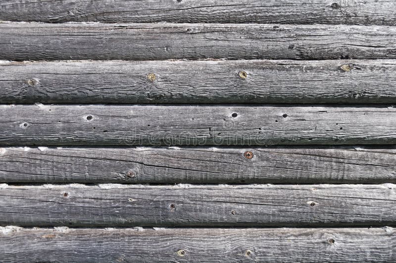 Fragment of old log wall background of abandoned wooden house. Rustic wooden log house stock images, royalty-free photos and pictures