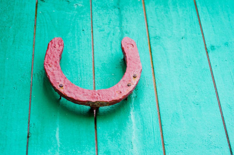 Old Lucky Horseshoe on Red Wooden Wall. Stock Photo Image of luck