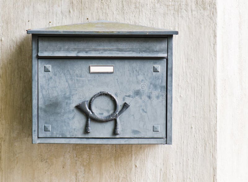 Old mailbox on a building wall royalty free stock photography