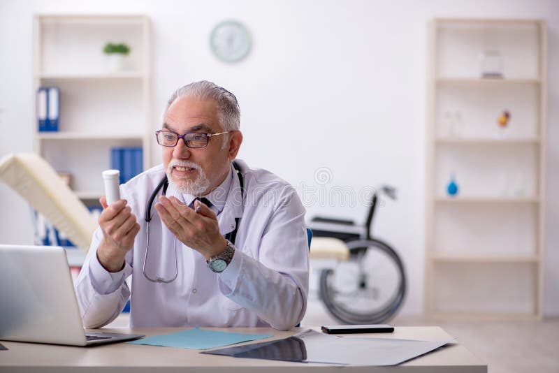 Old Male Doctor Working at the Hospital Stock Image - Image of drugs ...