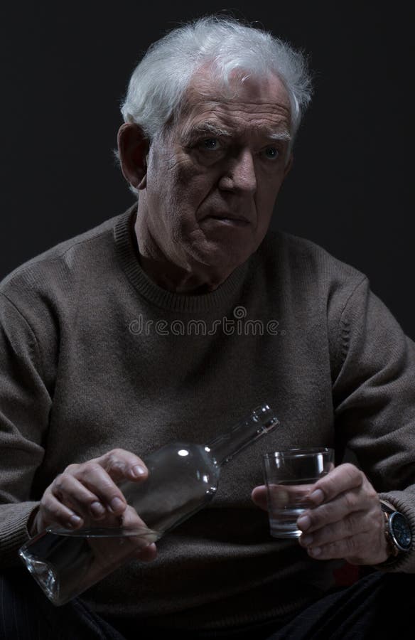 Old man drinking alcohol
