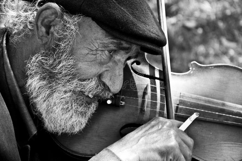 Old man playing violin stock images Old man playing violin stock images