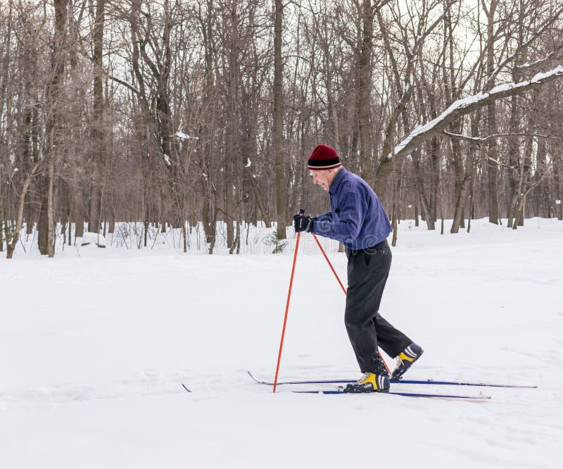 Man Cross Country Skiing With Son In Backpack Old Photo 