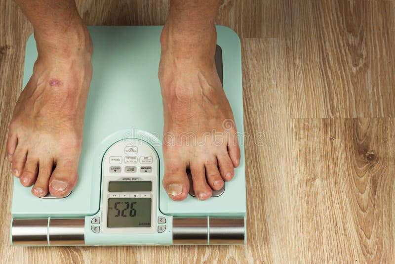 Measurement Of Body Weight Stock Photo - Download Image Now - Bathroom Scale,  Men, Only Men - iStock