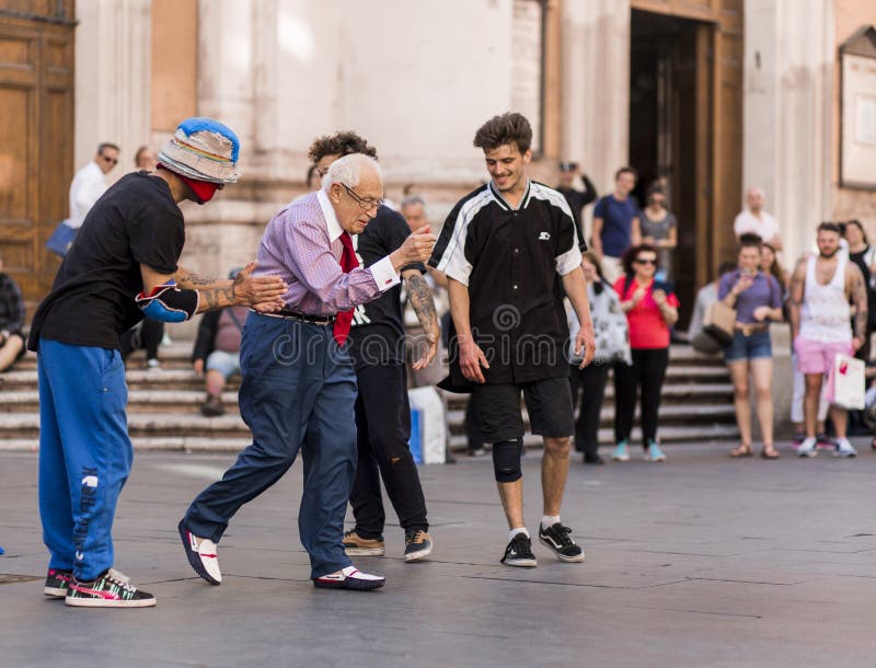 Old man street dancing in public Rome/Italy May 2017