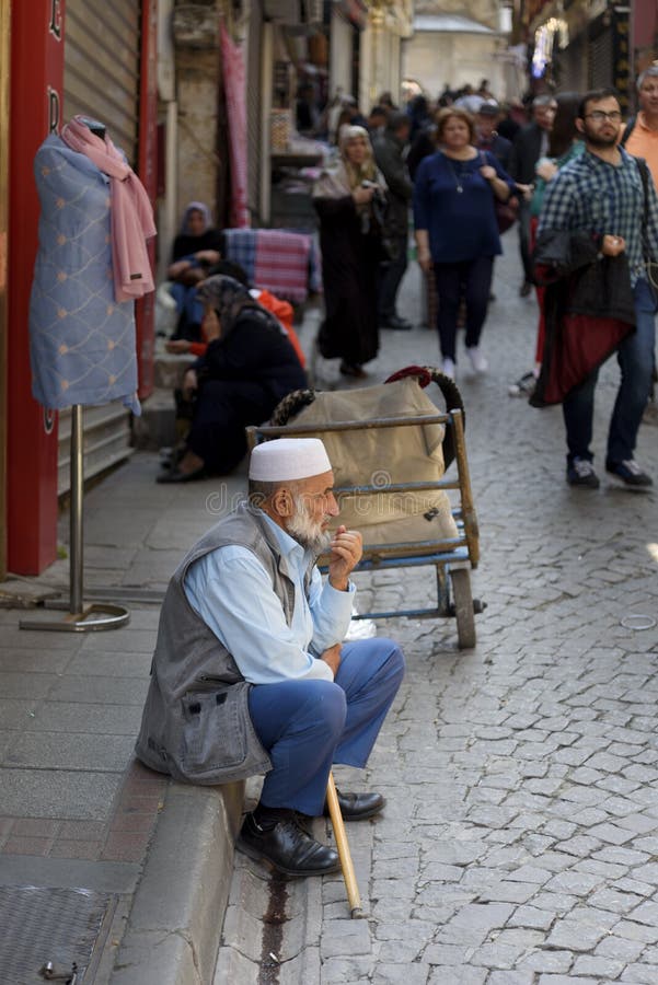 Group portrait of several young guys and one elderly man near stall with  turkish bagel at Taksim in Beyoglu, Istanbul Stock Photo - Alamy