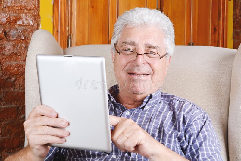 Old man using tablet. stock image. Image of elderly, adult - 85025759