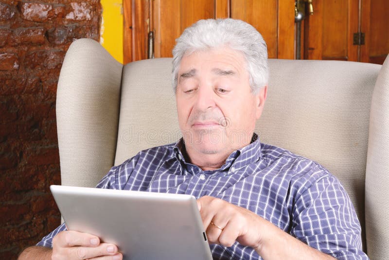 Old man using tablet. stock photo. Image of person, computer - 99593648