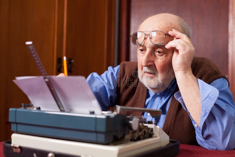 Old man working on a typewriter