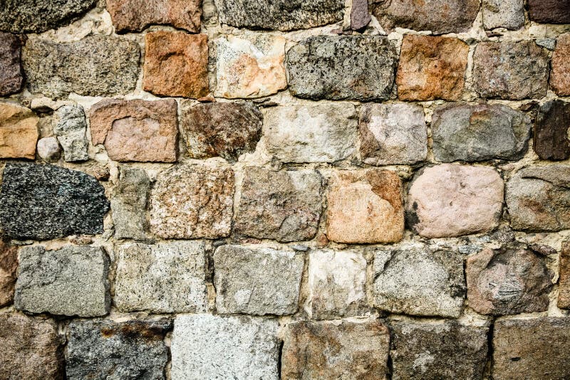 Old medieval stonewall, composed of large massive stone blocks, as abstract seamless texture background stock photography Old medieval stonewall, composed of large massive stone blocks, as abstract seamless texture background stock photography