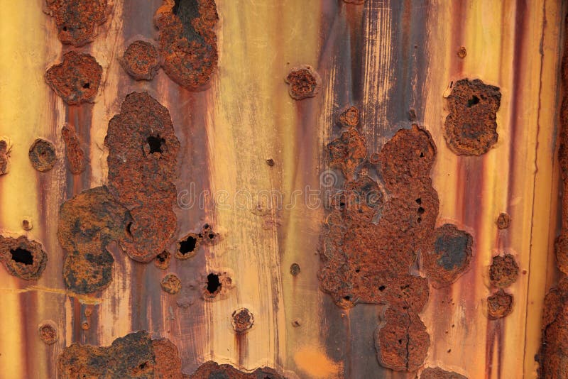 Old metal plate painted white with some rust. royalty free stock photo