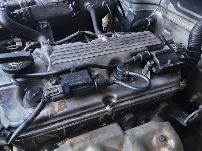 Old Model Car Injection Engine Where One Coil is Used To Burn Two Spark