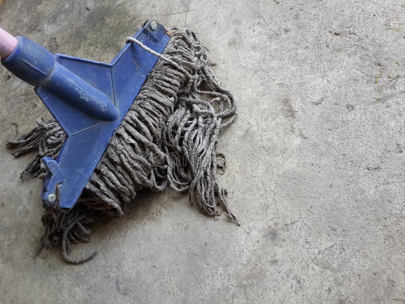 Old mop on cement floor stock image. Image of tool, plastic 109881289
