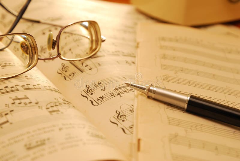 Old music score, manuscript and pen