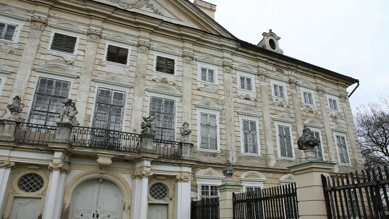 Old and neglected building with balcony and a lot of windows