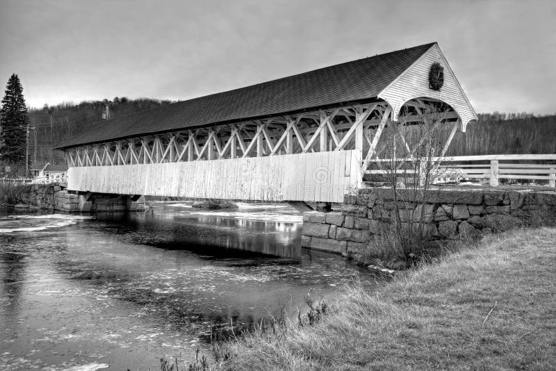 Old new england covered bridge in duotone black and white