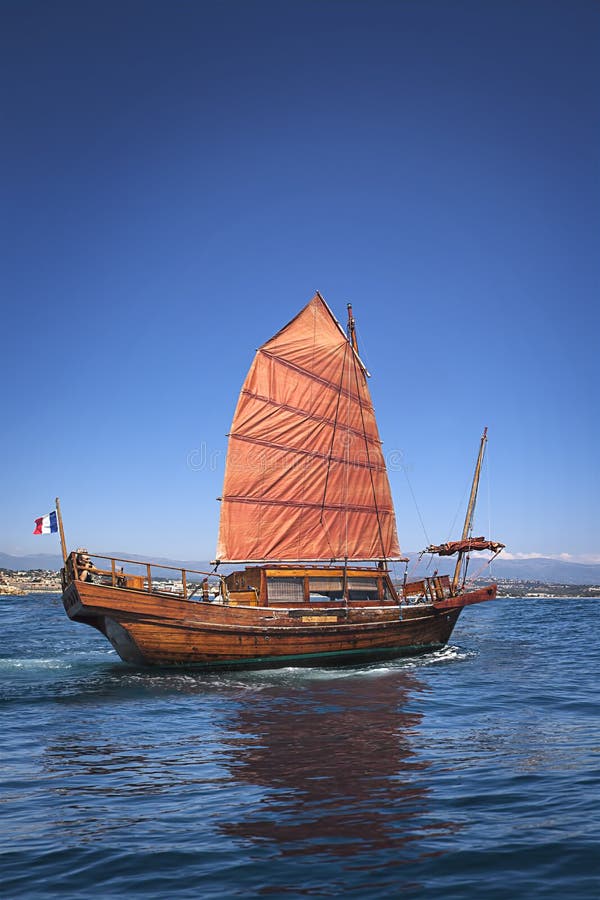 Old orange sail boat