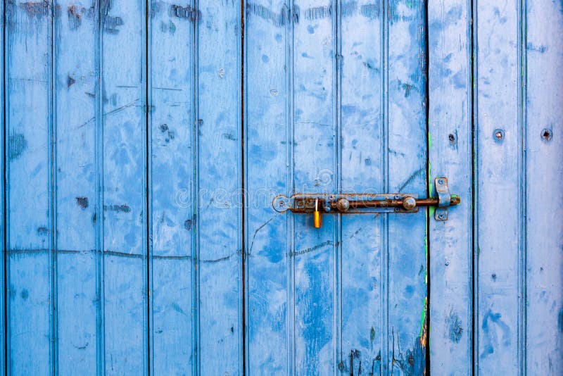 Old Painted Blue Door with Door Bolt. Stock Photo Image of europe