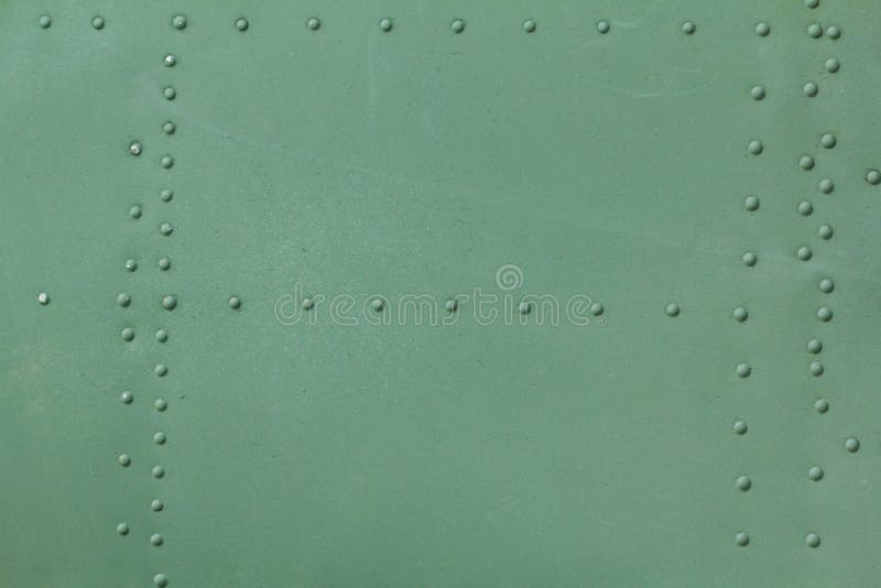 Old painted metal background detail of a military aircraft, surface corrosion. royalty free stock images