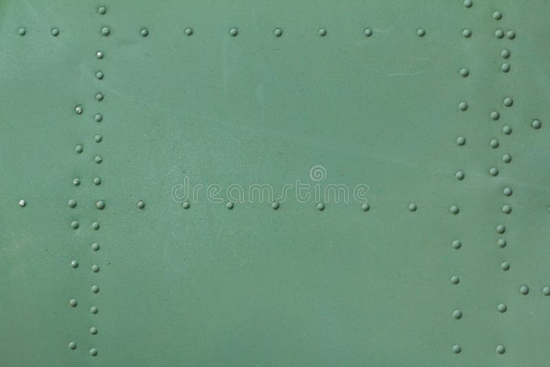 Old painted metal background detail of a military aircraft, surface corrosion. royalty free stock photos