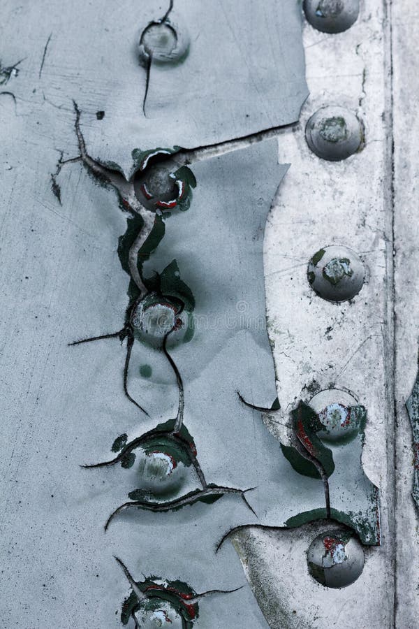 Old painted metal background detail of a military aircraft, surface corrosion. stock image