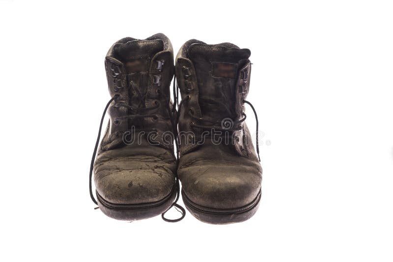 old pair of very worn black shoes, isolated on white background