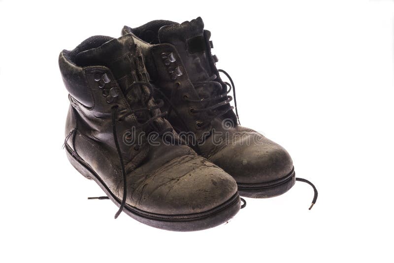 old pair of very worn black shoes, isolated on white background