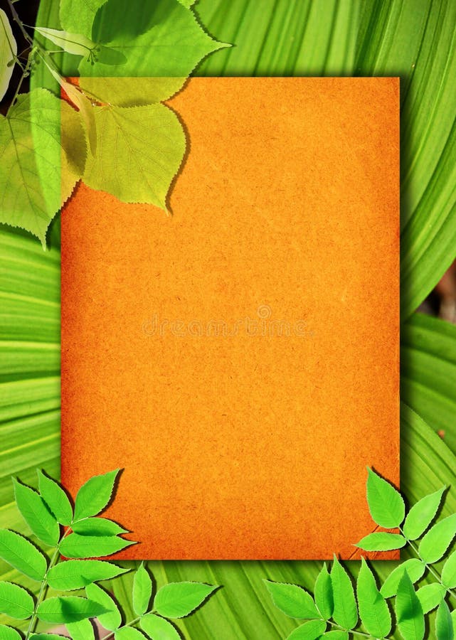 Old paper background with green leaves