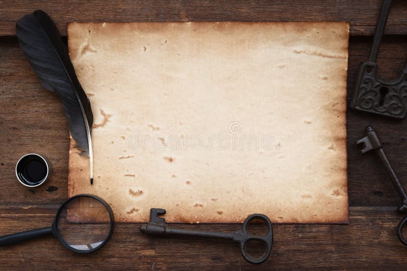Old paper on brown wood texture with key, feather and ink, magnifying glass