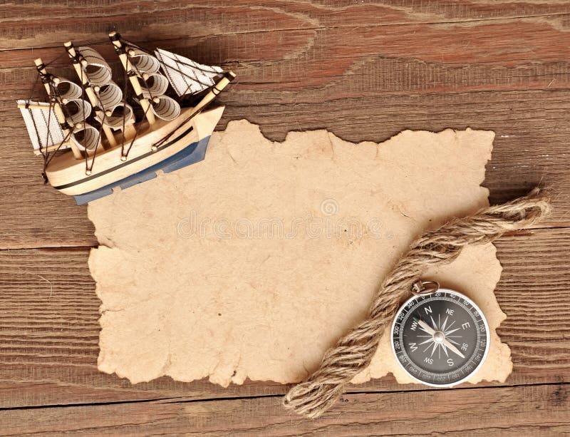 Old paper, compass, rope and model classic boat