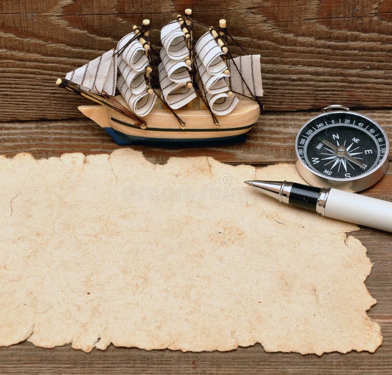 Old paper, compass, rope and model classic boat