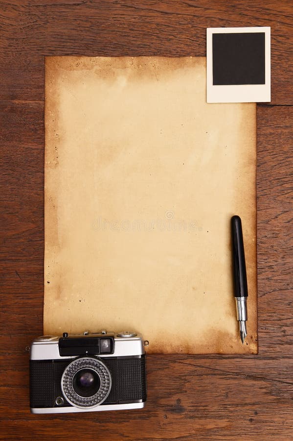 Old Paper, Ink Pen And Vintage Photo Frame With Camera Stock Image