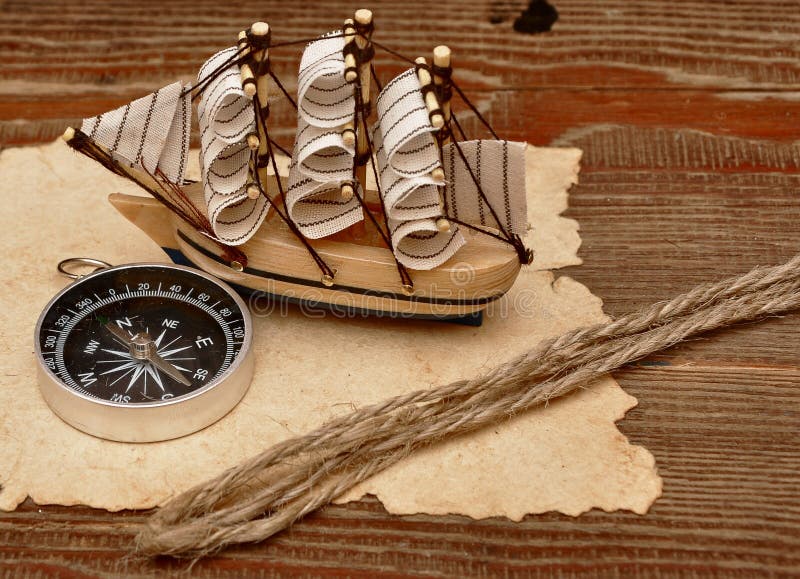 Old paper, rope and model classic boat