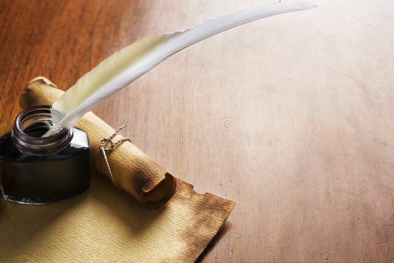Old paper, scroll and quill pen on wooden paper royalty free stock photography