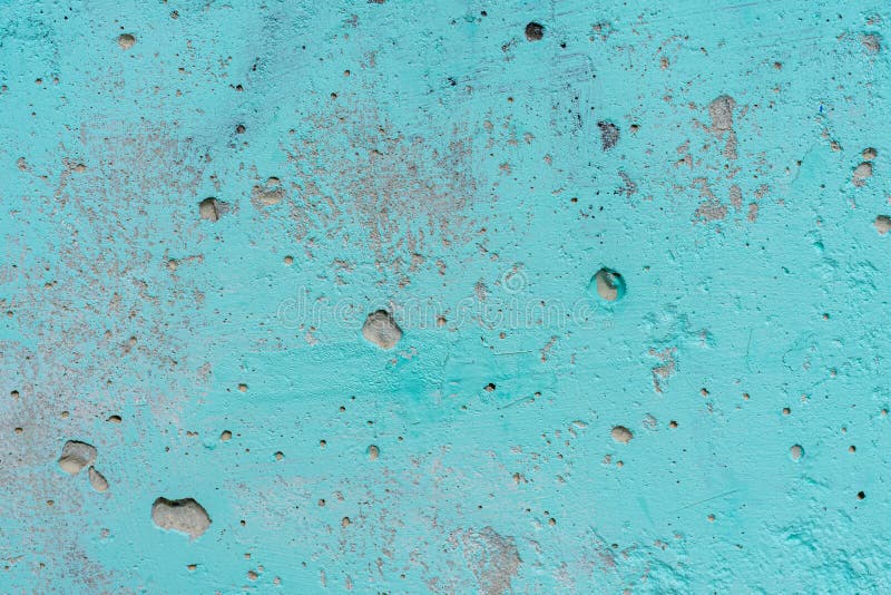 The old peeled plaster is painted blue stock images