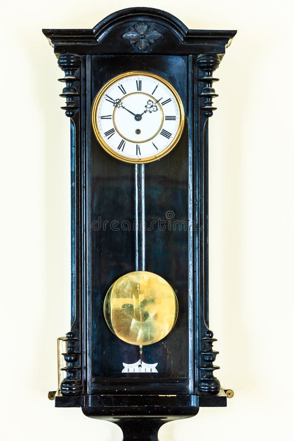 Old pendulum clock on wall royalty free stock image Old pendulum clock on wall royalty free stock image