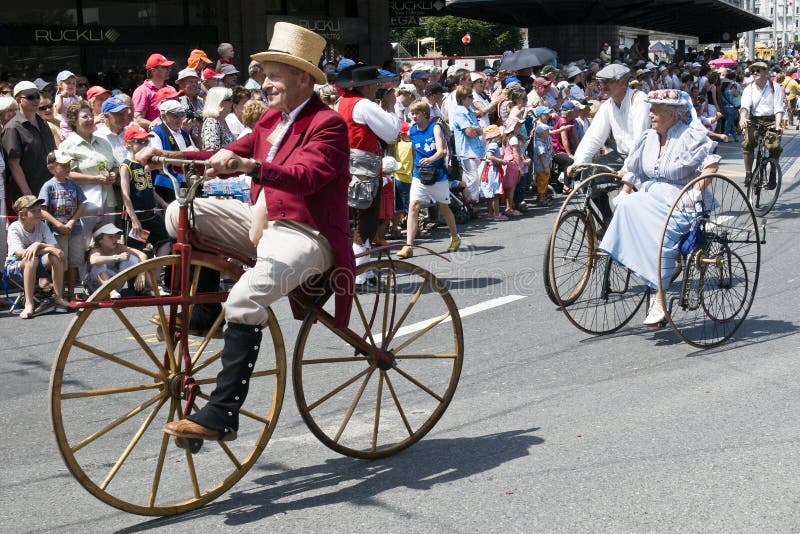 Old people riding époque bicycles during the jodler's parade in Luzern, Switzerland. Folklore costumes stock images, royalty-free photos and pictures