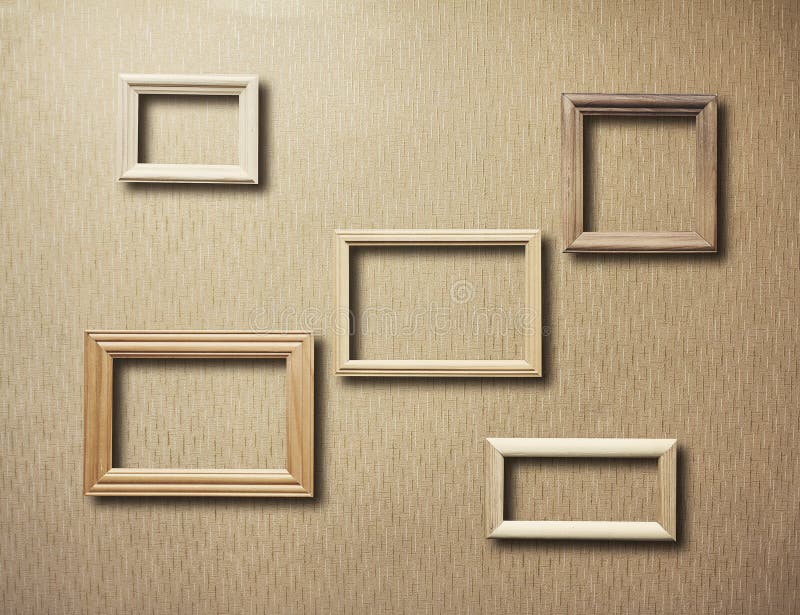 Old frames on wooden wall stock photo. Image of pattern 173815552